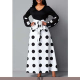 Model wearing the flowy mesh polka dot dress styled for an evening party