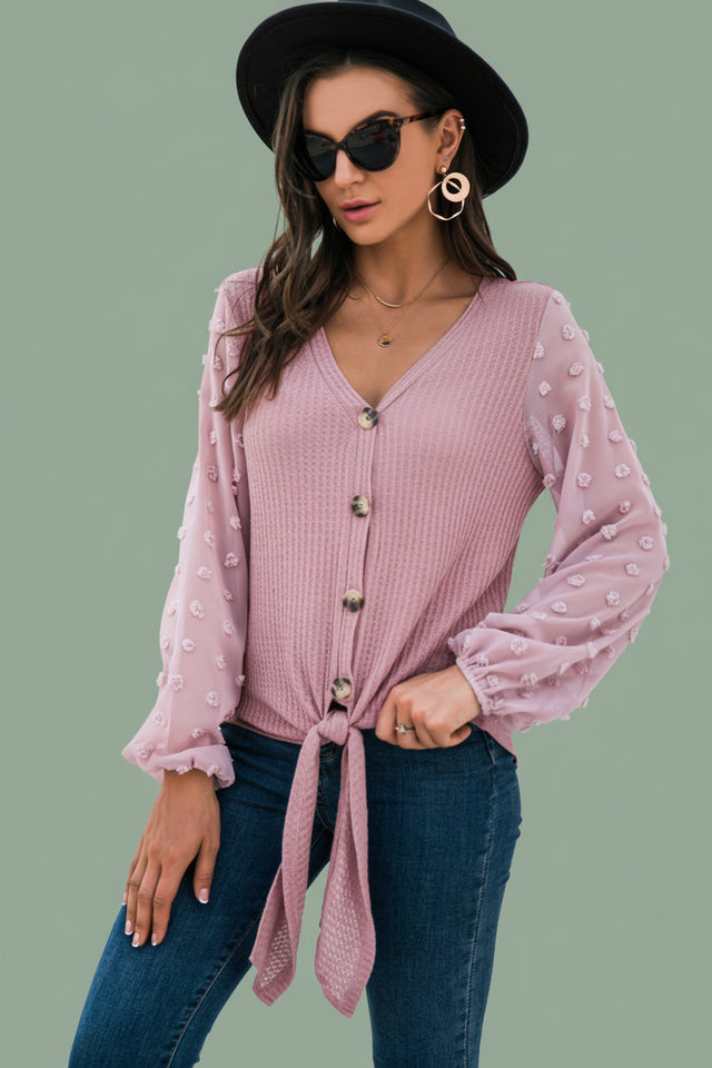 Soft knit V-neck cardigan front detail showing durable buttons