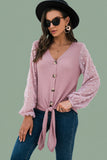 Soft knit V-neck cardigan front detail showing durable buttons