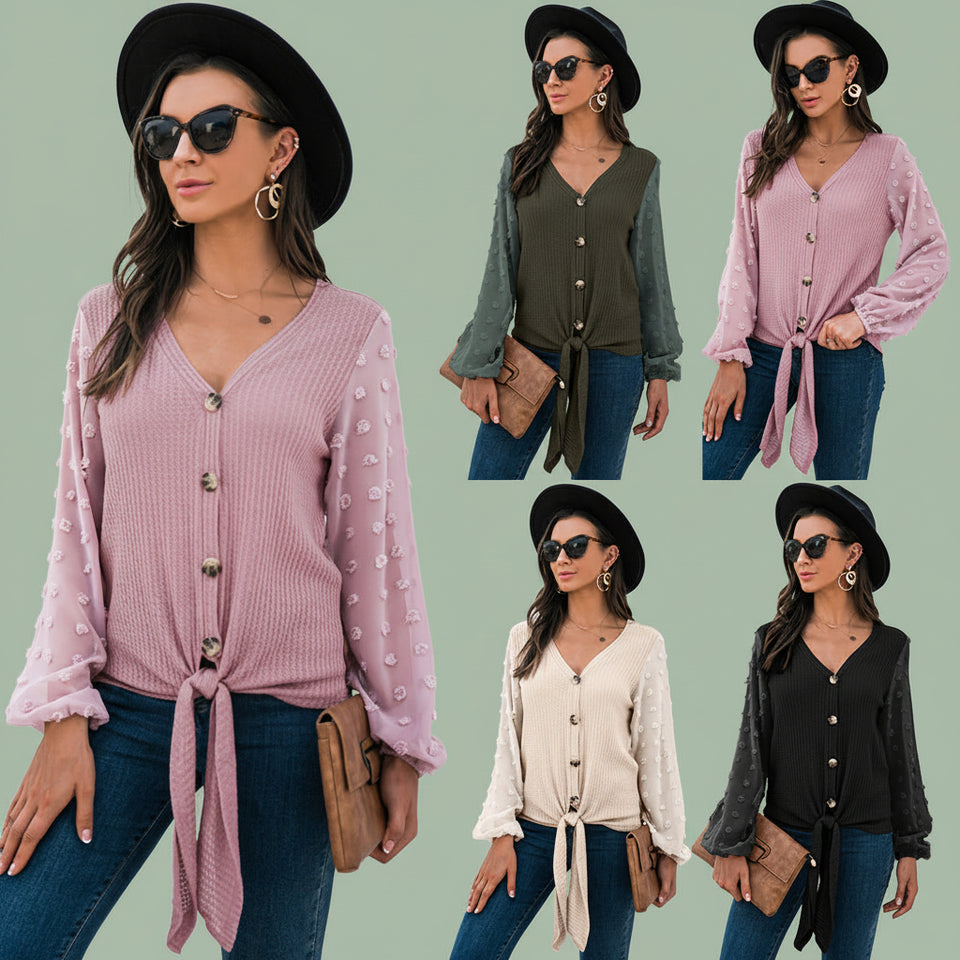 Woman wearing cozy pink V-neck knit cardigan sweater paired with jeans